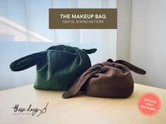 two bags sitting on top of a table next to each other with the words, the makeup bag digital sewing pattern