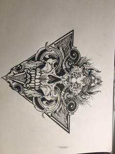 a drawing of a triangle with skulls and other things on the side, in black ink