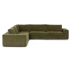 a green sectional couch with the back facing it's left arm and footrests