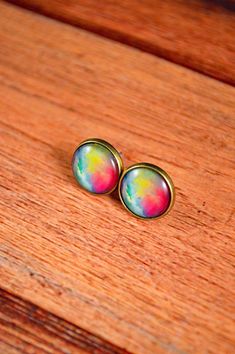 These pastel earrings are beautiful in color! These watercolor earrings are great for those who love the watercolor vibe, or enjoy the pastel look of the studs! They feature a rainbow pastel design, vibrant in color and a beautiful gift! These earrings measure about 12mm in diameter, or about half an inch. All studs come with a pair of rubber backings in order to secure the studs to your ears. All metals are antique bronze and hypoallergenic. All images are protected under a glass dome. Have any Rainbow Colorful Earrings For Gift, Colorful Round Earrings Gift, Colorful Earrings As A Gift, Colorful Round Earrings For Gift, Artistic Multicolor Hypoallergenic Jewelry, Watercolor Earrings, Pastel Jewelry, Galaxy Jewelry, Galaxy Earrings