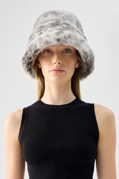 Add a touch of luxury to any outfit with the Yeoman Bucket Hat in Snow Leopard. Crafted meticulously with a cool gradient pattern and snow leopard imitation. Pair it with the Kathmandu Coat for a matching fit. Size & Fit- Standard Fit- Models are wearing the One-Size- See size guide above for detailed measurements Luxury Winter Hats With Faux Fur Lining, Luxury Winter Hat With Faux Fur Lining, Luxury Winter Hats With Short Brim, Fur Wrap Wedding, Cool Gradient, Hat Snow, Gradient Pattern, Fit Models, Cozy Accessories