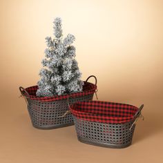 two baskets with christmas trees in them