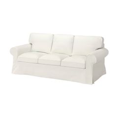 a white couch sitting on top of a white floor