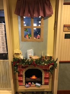 a decorated fireplace in the corner of a room with christmas decorations on it and presents under the window