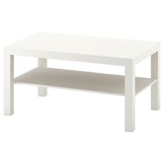 a white coffee table sitting on top of a white floor