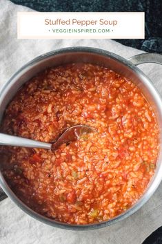 a pot full of red beans with a spoon in it and the title overlay reads stuffed pepper soup