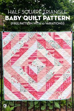 a pink and white quilt on a fence with text overlay that reads half square triangle baby quilt pattern free pattern with variations