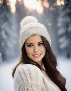 a beautiful young woman wearing a white hat and sweater posing for a photo in the snow