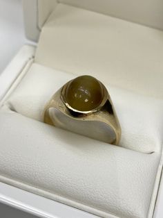 9carat yellow gold Gents tiger eye signet ring  Weight: 4.5grams  Ring size: V Price: £205.00 Classic Brown Signet Ring For Anniversary, Formal Gold Cabochon Signet Ring, Brown Polished Finish Signet Ring For Formal Occasions, Classic Gold Opal Ring, Gold Classic Moonstone Ring For Formal Occasions, Classic 14k Gold Signet Ring With Cabochon, Classic Gold Moonstone Ring With Oval Cabochon, Classic Yellow Gold Moonstone Ring With Polished Finish, Classic 14k Yellow Gold Moonstone Ring