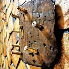 a close up of a wooden object on a wall