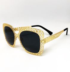 Flex in these exclusive Dani Joh gold and black sunglasses! These metal frame sunglasses are perfect for any season and are versatile enough to wear everyday. These sunglasses are made with metal hinges and 100% UV protected lenses. Enjoy these exclusive sunglasses and show us how you'll rock them by using the hashtag #ShopDaniJoh. Sunglasses Features: Black Sunglasses Metal Gold Frame Polarized lens 100% UV Protection One Size Elegant Gold Shield Sunglasses With Uv Protection, Chic Gold Cat Eye Sunglasses With Metal Frame, Gold Aviator Sunglasses With Gradient Square Frame, Gold Aviator Sunglasses With Gradient Lenses, Gold Aviator Sunglasses With Tinted Square Frame, Modern Metal Sunglasses For Parties, Gold Square Frame Aviator Sunglasses With Tinted Lenses, Modern Gold Shield Sunglasses With Metal Frame, Party Sunglasses With Metal Square Frame