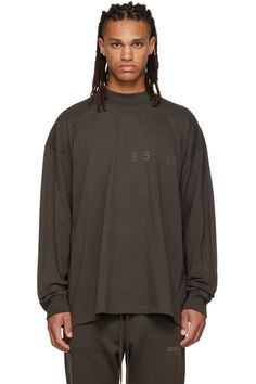 Essentials: Gray Flocked Long Sleeve T-Shirt | SSENSE Basic Streetwear T-shirt With Ribbed Cuffs, Basic T-shirt With Ribbed Cuffs For Streetwear, Fall Crew Neck Top With Logo Patch, Winter Long Sleeve Tops With Logo Patch, Sporty Crew Neck T-shirt With Ribbed Collar, Sporty T-shirt With Ribbed Collar And Crew Neck, Sporty T-shirt With Ribbed Crew Neck, Black Long Sleeve Top With Logo Patch, Streetwear Crew Neck Sweatshirt With Logo Patch