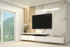 a large flat screen tv mounted to the side of a wall in a living room