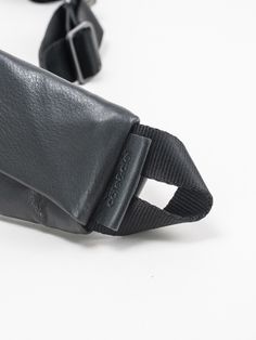 A luxury leather update of the zippered ADDA shoulder strap, this piece can be worn on its own, either as a minimal crossbody bag or around the waist. Using the matt metal carabiner clips on the black webbing straps, the ADDA can be attached to other côte&ciel products as an additional accessory, functioning as a carrying strap or extra storage compartment on bags. Carabiner Clip, Extra Storage, The Black, Crossbody Bag, Shoulder Strap, Leather, Black