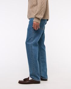 Our 90's Straight jeans that are relaxed through the thigh with a straight leg and a slightly higher rise in our vintage stretch fabric and broken-in denim feel. Paying homage to a fit that captures the essence of 90's authenticity through washes and fabrics, this is the kind of denim that you dream about finding in a thrift store! Features a dark wash and clean hem. Mens 90s, Men's Bottoms, You Dream, Suits Coats, Athletic Fits, New Arrival Dress, Swimwear Accessories, Mens Bottom, Straight Jeans