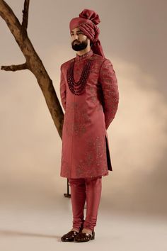 Red full sleeves sherwani in linen silk base with all over tone on tone resham work, gold zari and dabka details. Paired with full sleeves plain kurta, churidar, safa and embroidered border contrasting stole.
Components: 5
Pattern: Embroidery
Type Of Work: Resham, Zari, Dabka
Neckline: Band
Sleeve Type: Long
Fabric: Linen Silk
Color: Red
Other Details: 
Closure: 
Sherwani: Front hooks
Kurta: Front placket buttons
Note: The jewellery worn by the model is not for sale
Occasion: Groom - Aza Fashion Red Bollywood Sherwani With Straight Kurta, Elegant Long Sleeve Kurta With Zari Weaving, Festive Brocade Sherwani With Naqshi Detailing, Red Sherwani For Festivals, Red Sherwani For Festivals With Straight Kurta Style, Red Sherwani For Festive Occasions, Red Sherwani For Festivals With Straight Kurta Shape, Formal Sherwani With Zari Weaving, Ceremonial Sherwani With Zari Weaving