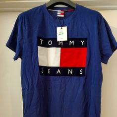 Tommy Hilfiger Big Flag Logo T Shirt Sz L Brand New One With Tag Size L Retail Price $50 Tommy Hilfiger Shirts Men, Vintage Tommy Hilfiger Jeans, Mens White Shorts, Tommy Hilfiger T Shirt, Jeans Logo, Tommy Hilfiger Shorts, Flag Logo, Logo T, Tommy Hilfiger Shirts