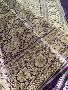 This is a very lovely handloom shikargah pure katan silk banarasi saree with very detailed large shikargah motifs all over the saree. The lovely brocade weave against the dark wine/dark plum/dark purple shade gives it an excellent embossed regal look.Saree has a detailed floral motif pallu and finished with sequined tassels that complement the saree. Borders on either side has floral motifs. Saree comes with an unstitched blouse piece. Falls and pico are done. Colour may vary slightly depending upon the lighting and individual device settings. Handloom products may have some irregularities unlike power loom products. Dry clean only. All sales are final. Pictures were taken during the day in natural light. Purple Banarasi Silk Saree With Self Design, Purple Banarasi Silk Traditional Wear For Puja, Purple Jamawar Saree With Self Design, Purple Jamawar Dupatta For Puja, Purple Katan Silk Saree With Self Design, Purple Banarasi Silk Handloom Saree, Purple Jamawar Traditional Wear With Zari Weaving, Purple Zari Weaving Saree For Puja, Purple Zari Weaving Dupatta For Festivals