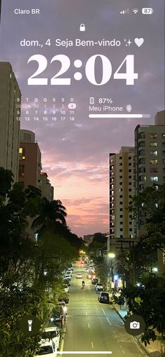 an image of a city street at night with the time on it's screen