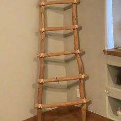 a wooden ladder leaning up against the wall