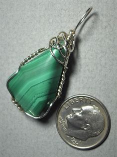 Malachite Pendant Wire Wrapped .925 Sterling Silver display - Jemel Unique Green Sterling Silver Jewelry, Adjustable Green Jewelry With Polished Finish, Adjustable Green Polished Jewelry, Green Sterling Silver Wire Wrapped Jewelry, Green Wire Wrapped Sterling Silver Jewelry, Wire Wrapped Green Sterling Silver Jewelry, Unique Green Spiral Jewelry, Green Malachite Cabochon Jewelry, Green Malachite Wire Wrapped Jewelry