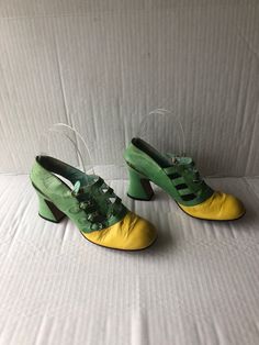 "sz 8 length 10.5\" insole 10\"width 3\" heel height 3\" vintage 1960s boho fun shoes  green and yellow buckle up shoes 4 straps and buckles round  square toe high Cuban heel leather sole and lining unique style DON VICENTE label good condition sustainable fashion made in the SPAIN" Retro Green Closed Toe Heels, Vintage Green Round Toe Heels, Vintage Green Heels With Round Toe, Green Retro Closed Toe Heels, Green Closed Toe Retro Heels, Retro Green Heels With Round Toe, Retro Green Round Toe Heels, Green Retro Heels With Round Toe, Retro Heels With Leather Sole For Spring