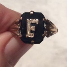 Stunning Art Deco 1920's black onyx and 9ct gold initial F  ring. Here we have an Art Deco ring with a lightly engraved gold initial F set onto black onyx. The initial F has simple gold shoulders in an openwork pattern in keeping with the clean lines of the Deco ring. The ring is in a good antique condition. The black onyx has a minor nick on the edge of  the onyx - to the left of the initial F and the usual rubs and minor scratches associated with normal use. The antique ring is marked 9c  inside the shank for 9ct gold. The onyx is firmly held in place with a claw  gold setting. The gold band is good and strong. A great statement or stand alone ring, and a lovely addition to your jewellery collection. Measures: Ring size: UK. N. 1/2.     US. just over 6 3/4                    Ring face: Black 14k Gold Engraved Jewelry, Engraved Black 14k Gold Jewelry, Engraved 14k Black Gold Jewelry, Black 14k Gold Engraved Ring For Anniversary, Victorian Black Engraved Ring In 14k Gold, Black 14k Gold Engraved Ring, Black 14k Gold Engraved Signet Ring, Black Engraved 14k Gold Ring, Black 14k Gold Hallmarked Engraved Ring