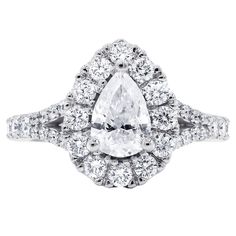 Certified 18 karat white gold diamond engagement ring features natural 1.15 carat pear cut diamond in the center and accented by 0.82 cts round cut diamonds on the side and set in custom made halo mounting. • Style- Halo Ring • Center Stone Shape-Pear • Center Carat Weight -1.15 • Total Carat Weight -1.97 • Certification-AGI • Color and Clarity Scale -I/I2 • Metal Type -18 karat white gold Pear Cut Diamond Ring, Pear Cut Ring, Gold Diamond Engagement Ring, White Gold Diamond Engagement Ring, Pear Cut Diamond, Halo Ring, Jewelry Rings Engagement, Pear Cut, Round Cut Diamond