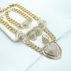 18k Gold Filled Iced Curb Link Chain with CZ Heart Charms Set, Necklace, Bracelet, Earrings & Ring, Wholesale Jewelry Making Supplies.Set Size:Necklace: -Length: 19 inches + 3.3 inches extender | Width: 13mm | Big heart: 47mm x 45mm | Medium Hearts: 26mm x 23mmBracelet:-Length: 8 inches + 3.2 extender | Width: 13mm | Heart: 26mm Earrings: 27mmRing :-Thickness: 4mm | Hand Width: Adjustable | Hand Thickness: 17mm Charm Set, Big Heart, Wholesale Jewelry, Jewelry Making Supplies, Heart Charm, Necklaces Bracelets, Ring Earrings, Gold Filled, 18k Gold