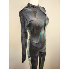 This high neck, long sleeve unitard is 4 way stretch, matte black spandex with silver holographic print. The chest has a black power mesh cut out at the center. The keyhole back closes with a silver metal locking clasp at the neck.  This is a made to order item that takes 1 - 2 weeks to ship. Please choose your size or include your measurements in the comment section at checkout. My size chart and measurement instructions are here https://www.etsy.com/listing/157664048/harmony-threads-size-chart Long Sleeve Unitard, Thread Size Chart, Holographic Print, Silver Holographic, High Neck Long Sleeve, Black Power, Womens Bodysuit, Catsuit, 3 Weeks