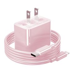 the pink charger is plugged in to an iphone charging station with two usb cables