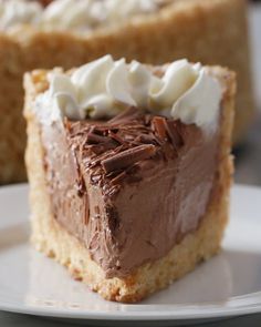 a piece of cake with chocolate frosting and whipped cream on top