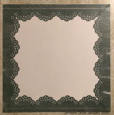 a square shaped paper with an intricate border