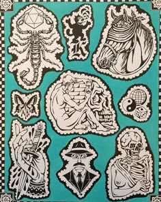 some stickers that are on the side of a blue paper sheet with black and white designs