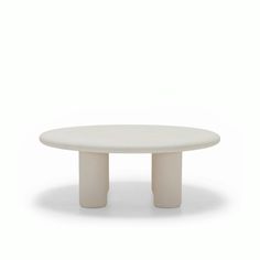 a white table with two legs and a round top on an isolated, white background