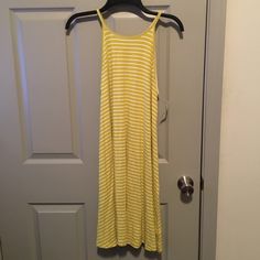 Old Navy Mustard Colored Striped Tank Dress. 95% Rayon/Viscose Blend And 5% Spandex Material. New. Yellow Knee-length Casual Sundress, Yellow Casual Knee-length Sundress, Casual Yellow Knee-length Sundress, Yellow Summer Midi Dress Knee-length, Yellow Knee-length Midi Dress For Summer, Yellow Sleeveless Midi Dress For Daytime, Yellow Knee-length Sundress For Day Out, Casual Yellow Maxi Dress For Daytime, Mustard Casual Midi Dress For Spring