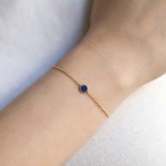 A single Semi-Precious Lapis Lazuli Circle adorns a minimal 14K Solid Yellow Gold chain. The perfect gift for September birthdays 14K Solid Gold Blue Lapis Gemstone Chain Thickness 1.2mm Lapis Lazuli Diameter 6mm Chain Length: 6-6.75in(15-17cm), 6.75-7.5in(17-19cm) Hypoallergenic, lead and nickel free #BS077 Minimalist Blue Bracelet With Delicate Chain, Blue Minimalist 14k Gold Filled Bracelets, Minimalist 14k Gold Filled Bracelets With Gemstones, Elegant Blue Bracelets With Delicate Chain, Elegant Blue Bracelet With Delicate Chain, Minimalist Yellow Gold Bracelet With Birthstone, Circle Bracelet, Metal Shop, Blue Lapis