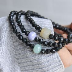 Size: /Black Beads: around 5mm /Lavender Bead: W9.1 x T7.1 mm /Light Green bead: W9 x T6.9 mm /Greyish yellow bead: W8.3 x H8 x T7.5 mm /Bracelet length: around 17cm Inner circumference.  *Have natural stone lines, black dots.  *Please note the original colors may be a little bit different from what you see on your monitor. Handmade by me with love and care in HK Black Bracelet With 108 Beads, Black Healing Beaded Bracelets With Round Beads, Black Crystal Bracelet With Faceted Beads, Black Jade Round Beads Jewelry, Black Jade Jewelry With Round Beads, Black Spiritual Bracelet With Faceted Beads, Spiritual Black Bracelets With Faceted Beads, Black Jade Bracelets Gift, Black Stretch Bracelet With Faceted Beads As Gift