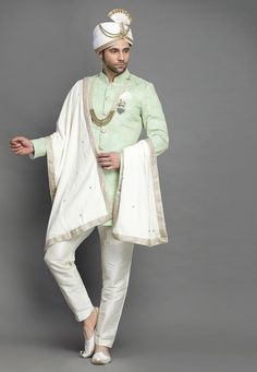 Art Silk Sherwani in Light GreenThis Readymade attire is Enhanced with Buttons and Resham Work. Crafted in Chinese Collar Neck and Full SleeveAvailable with an Art Silk Pant in Off WhiteDo note: Turban, Kanthimala, Dupatta, Brooch and Footwear shown in the image is for presentation purposes only. Half to one inch may vary in measurement. In case you want to purchase the Dupatta (WEBSITE ITEM CODE: MXX300). (Slight variation in actual color vs. image is possible) We sell all kinds of menswear. Me Indian Jackets, Vs Image, Mens Sherwani, Resham Work, Silk Pant, Mens Kurta, Kurta Pyjama, Chinese Collar, Party Mode