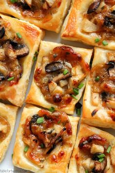 small square pizzas with mushrooms on them sitting on a white plate, ready to be eaten