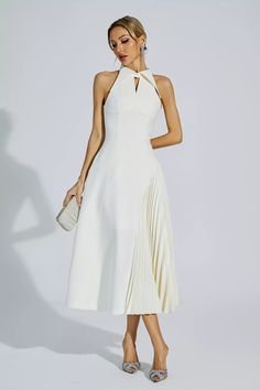 Cynthia Cream Ruched Midi Dress Fitted A-line Midi Dress With Folds, Chic A-line Pleated Dress, Chic A-line Sleeveless Cocktail Dress, Pleated A-line Midi Dress For Dinner, Chic A-line Midi Dress With Pleated Skirt, Ruched A-line Pleated Party Dress, Chic A-line Ruched Dress, Elegant Summer A-line Halter Dress, Elegant White Sleeveless Dress With Pleated Bodice