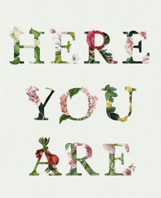 the words fire you are written with flowers on white paper and surrounded by green leaves