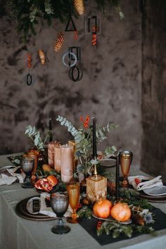 the table is set with candles and decorations