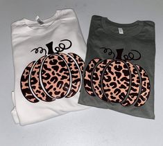 Cheetah print goes with everything! Pumpkins are no exception This unisex Bella canvas tee comes with the cheetah print pumpkin design as shown above. All designs are hand pressed with professional grade heat transfer vinyl. Please leave shirt color in the personalization box Xs-3x Casual Leopard Print T-shirt For Fall, Fall Leopard Print Graphic T-shirt, Fall Leopard Print Tops With Letter Design, Fall Leopard Print Top With Letter Details, Cheetah Print Pumpkin, The Cheetah, Fall Tee, Pumpkin Fall, Pumpkin Shirt