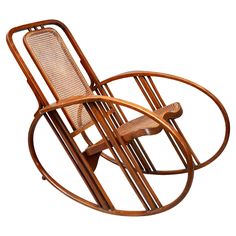 the rocking chair is made from wood and has wickers on it's sides