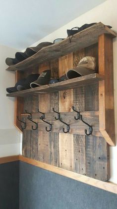 the shoe rack is made out of wood and has shoes hanging on it's hooks