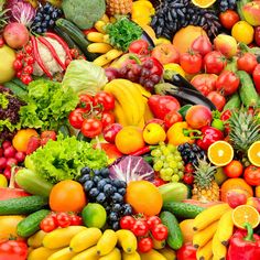 many different types of fruits and vegetables are arranged in the shape of a pile together