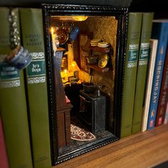 a book shelf filled with lots of books next to a mirror on top of it