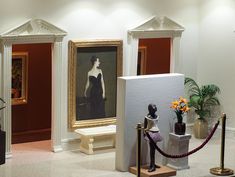 an art gallery with paintings and sculptures on display in it's centerpieces