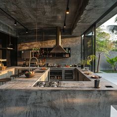 a kitchen with concrete counter tops and an island